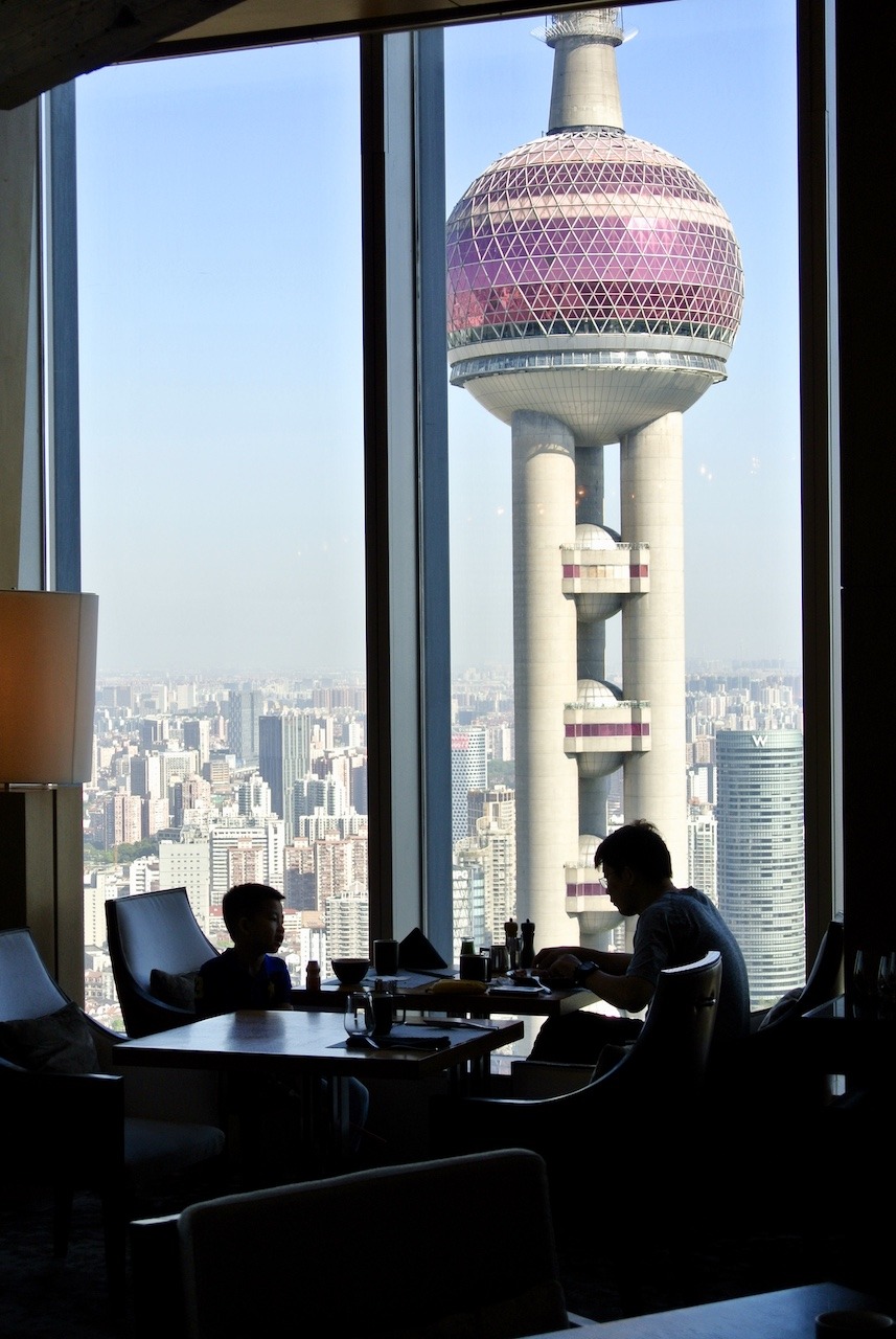 Ritz-Carlton Shanghai Pudong, On Top of the World Hawaii Calling Sena restaurant seating with Oriental Pearl in background