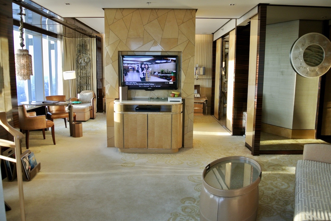 Ritz-Carlton Shanghai Pudong, On Top of the World Hawaii Calling Suite living room to the bedroom
