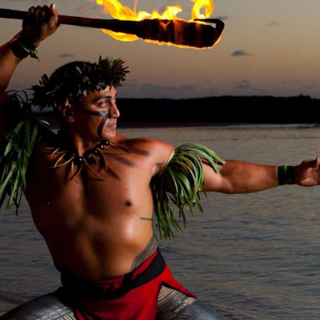 The 27 Best Luaus In Hawaii - By Island (2025) Hawaii Calling Paradise Cove Fire dancer at one of the best luaus in Hawaii