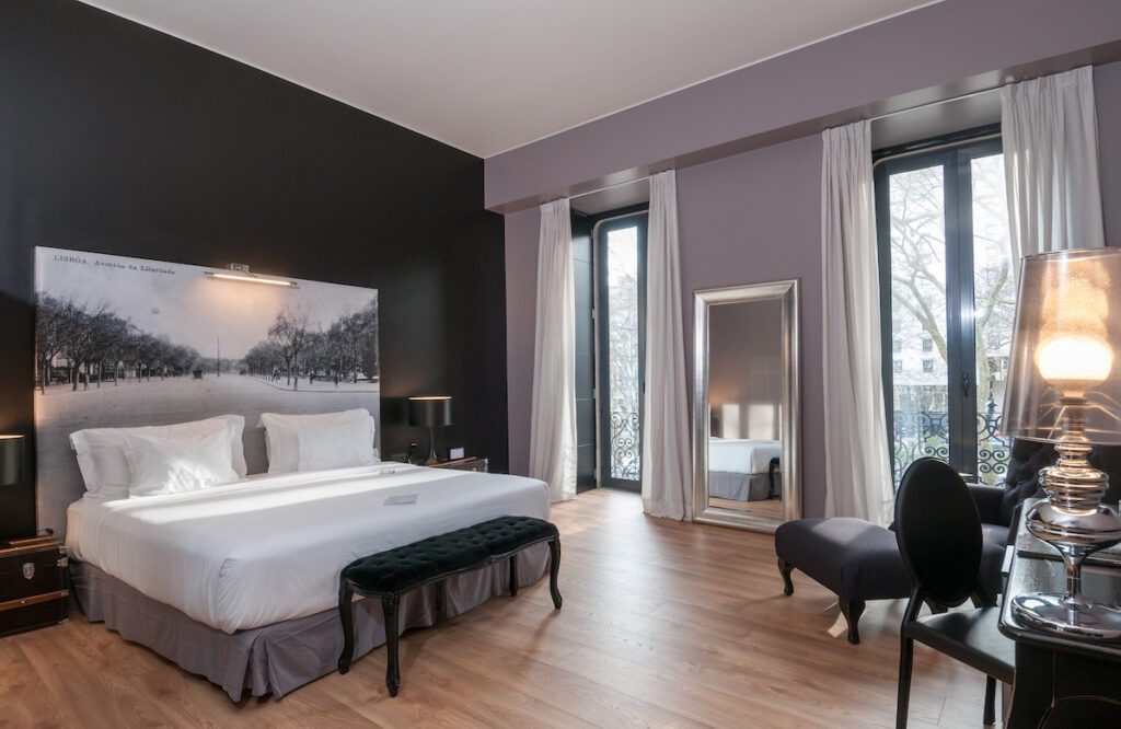 Fontecruz Lisboa an Autograph Collection Hotel, Classic Vintage Hawaii Calling a bedroom with a bed and chairs