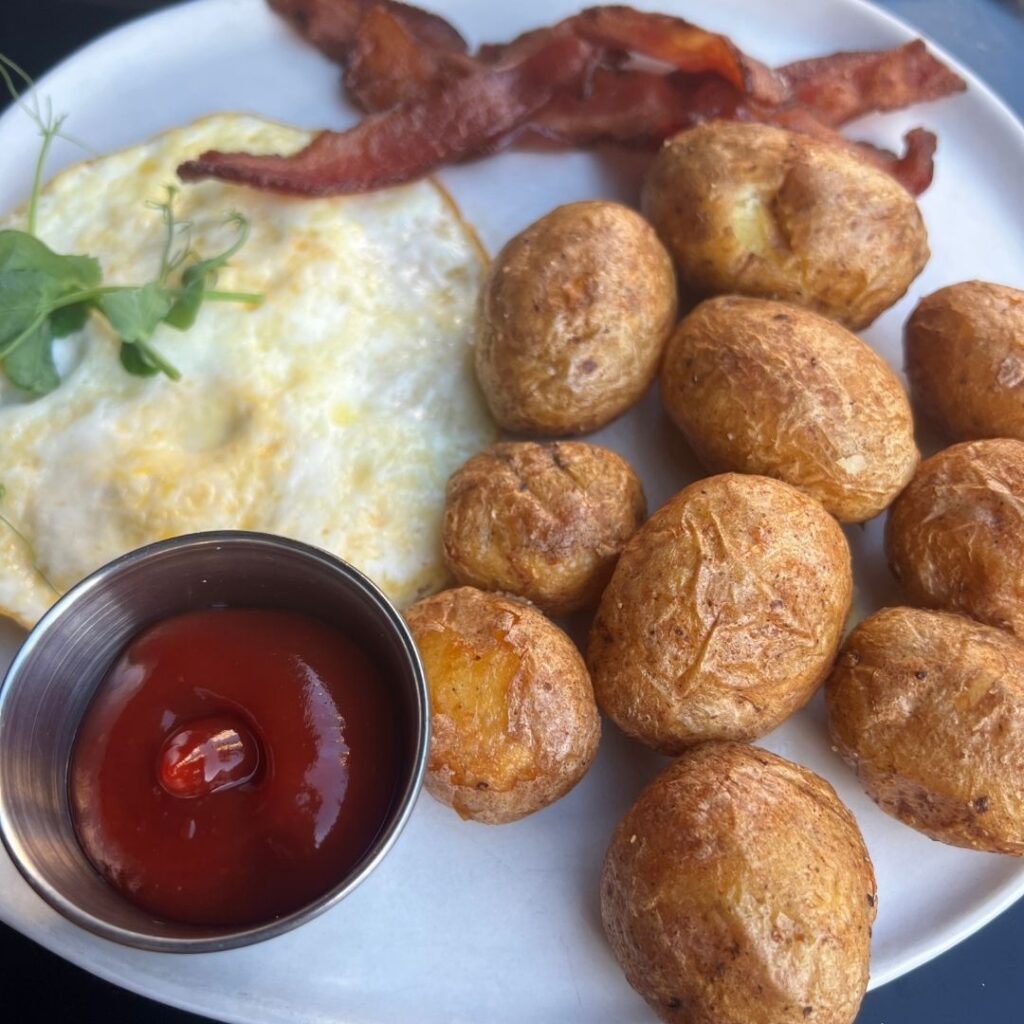 Review & Video: The Laylow Waikiki, Autograph Collection in Waikiki, Unique and Fun Hawaii Calling a plate of food with a bowl of ketchup and eggs
