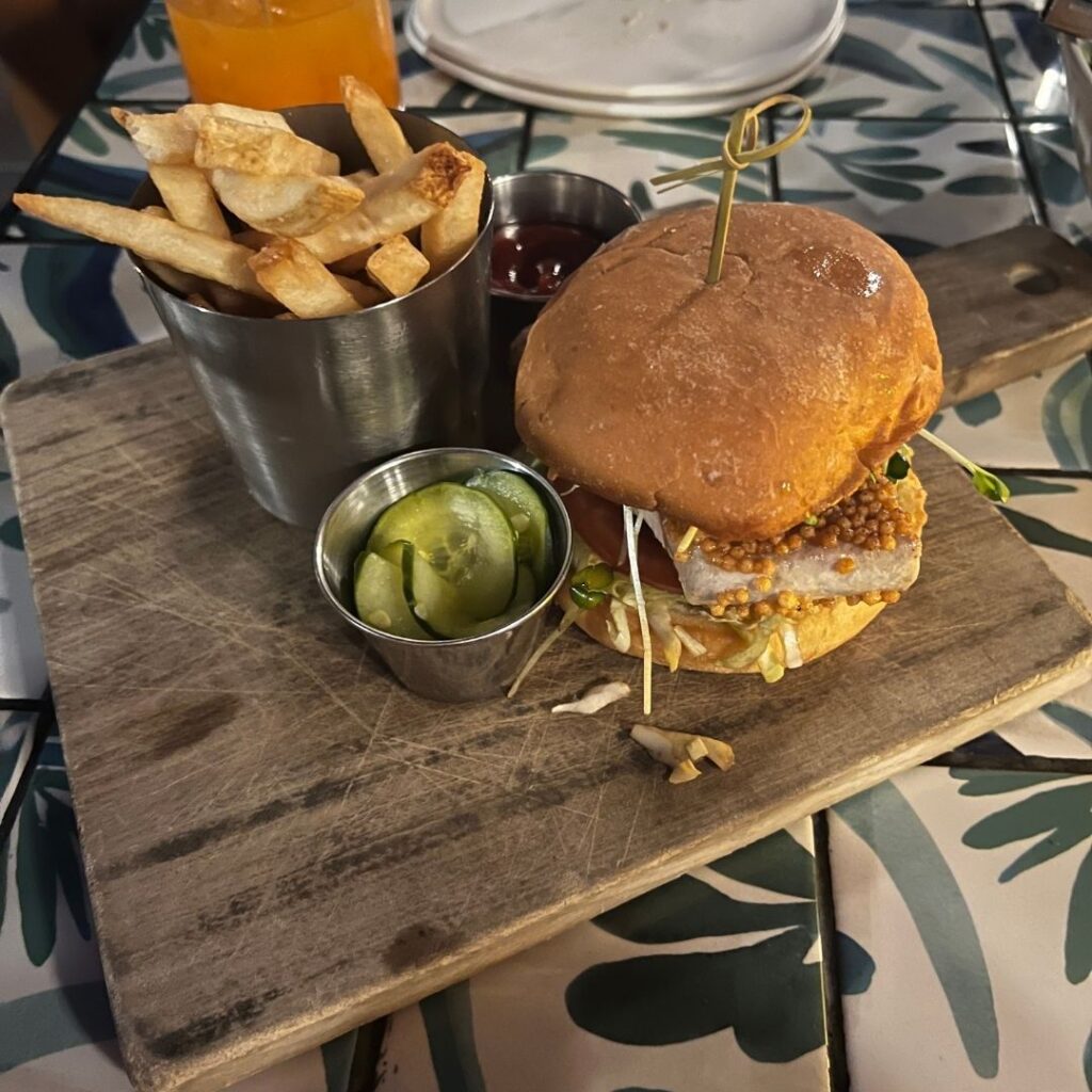 Review & Video: The Laylow Waikiki, Autograph Collection in Waikiki, Unique and Fun Hawaii Calling a burger and fries on a wooden board