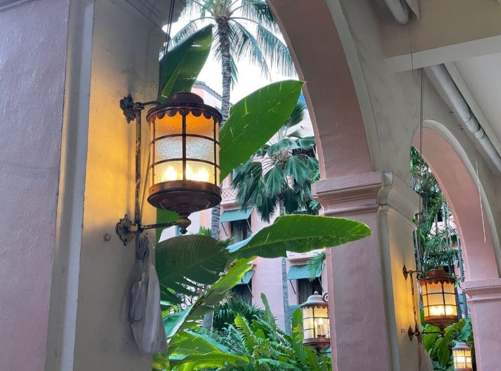 Review & Video: The Royal Hawaiian, Waikiki, A Luxury Collection Hotel Hawaii Calling a light fixture on a wall