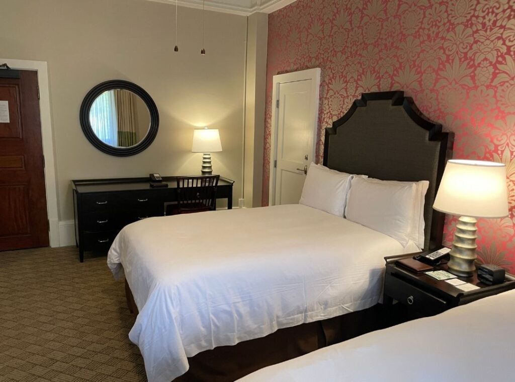 Review & Video: The Royal Hawaiian, Waikiki, A Luxury Collection Hotel Hawaii Calling a room with two beds and a mirror