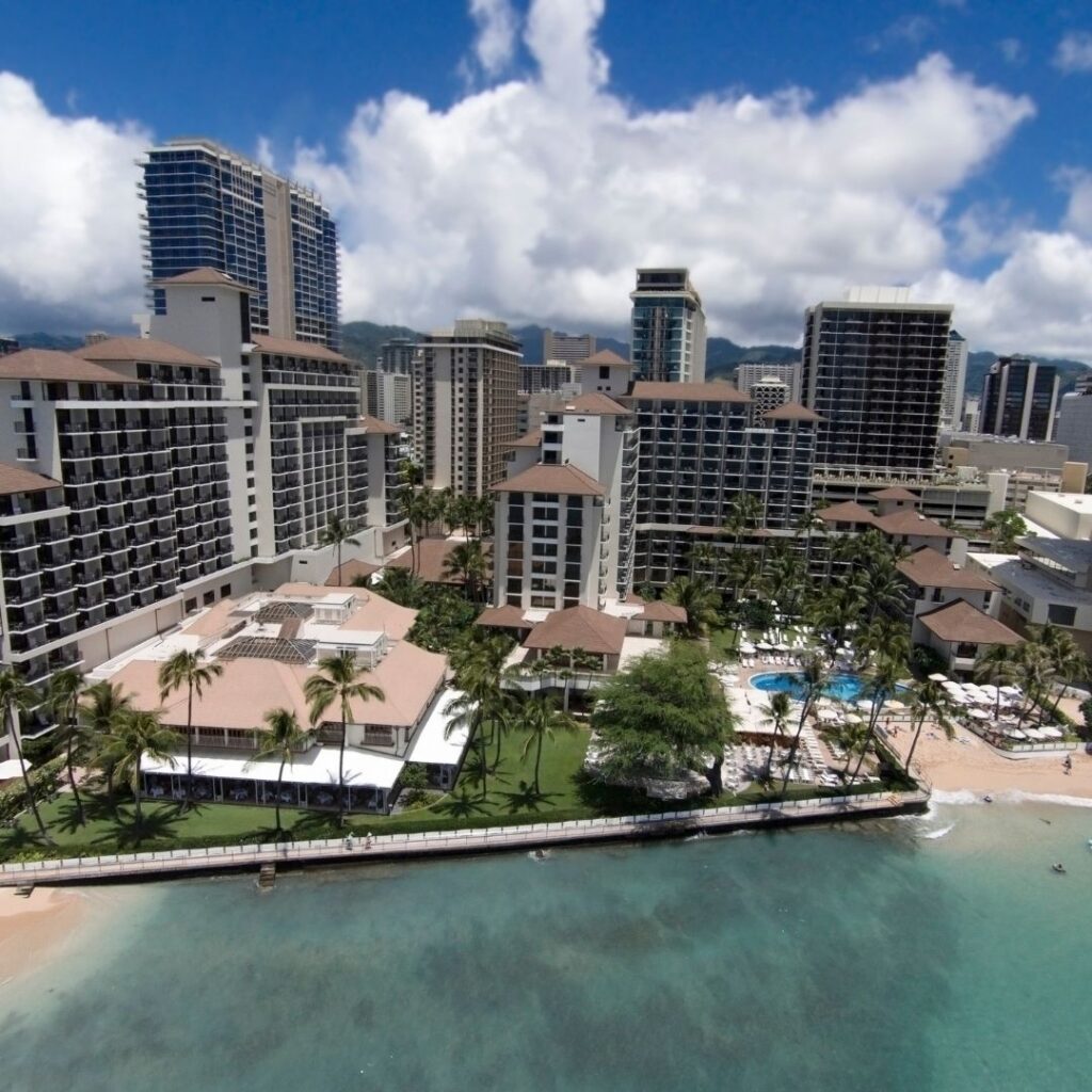 7 Best Luxury Hotels on Oahu (2025) Hawaii Calling a beach with buildings and a body of water