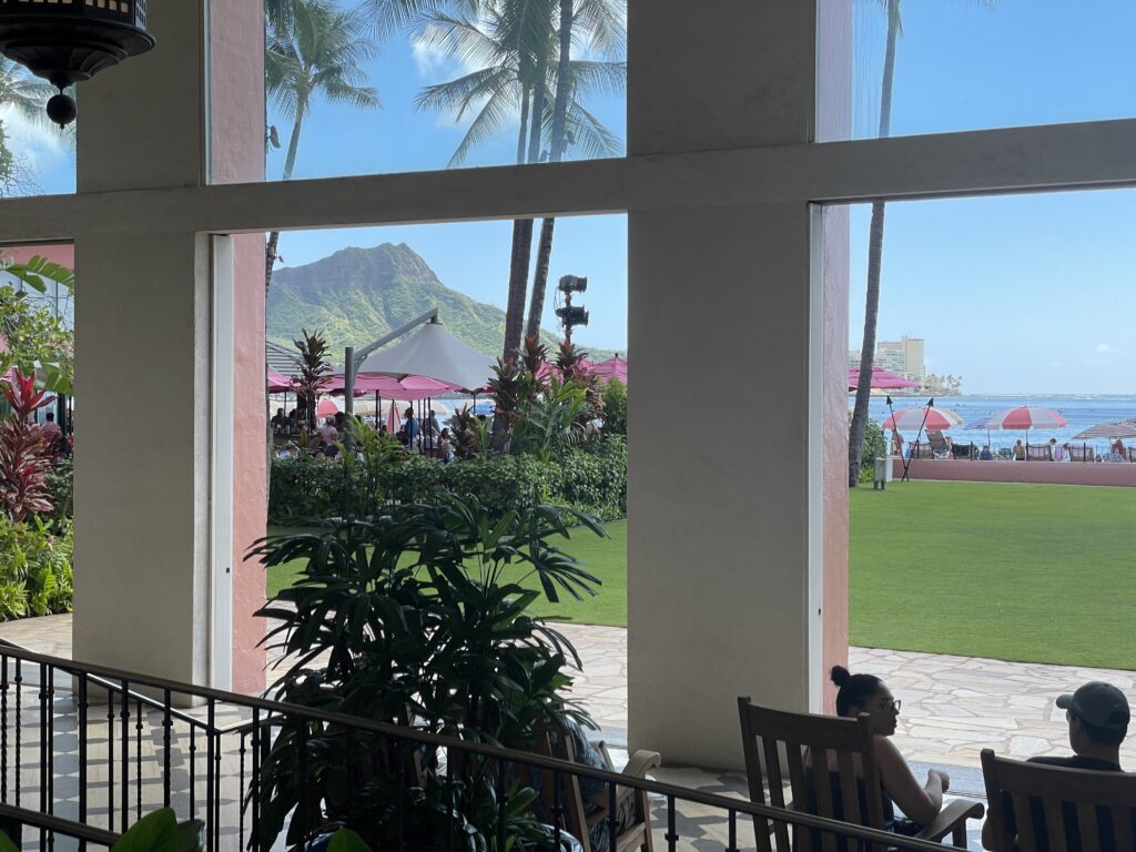 7 Best Luxury Hotels on Oahu (2025) Hawaii Calling a woman sitting in a chair outside with a large window