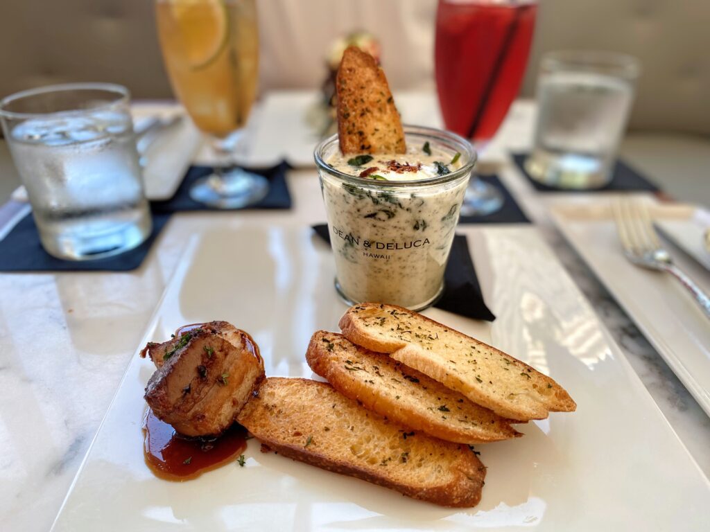 Review & Video: The Ritz-Carlton Waikiki Beach, Luxurious Residences & Hotel Hawaii Calling a plate of food on a table