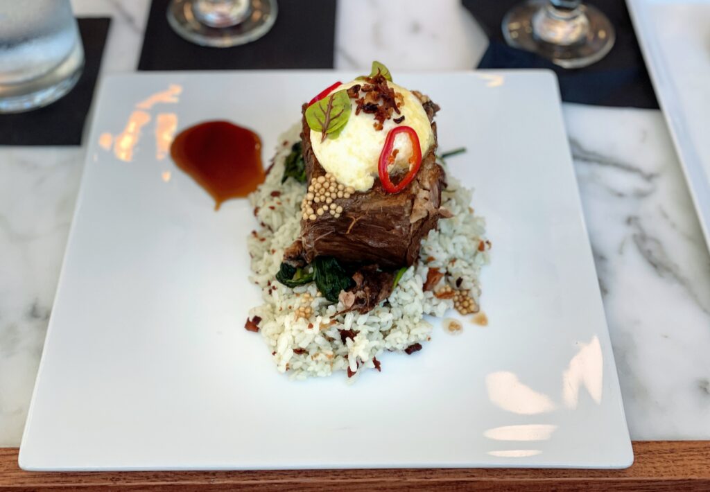 Review & Video: The Ritz-Carlton Waikiki Beach, Luxurious Residences & Hotel Hawaii Calling a plate of food on a table