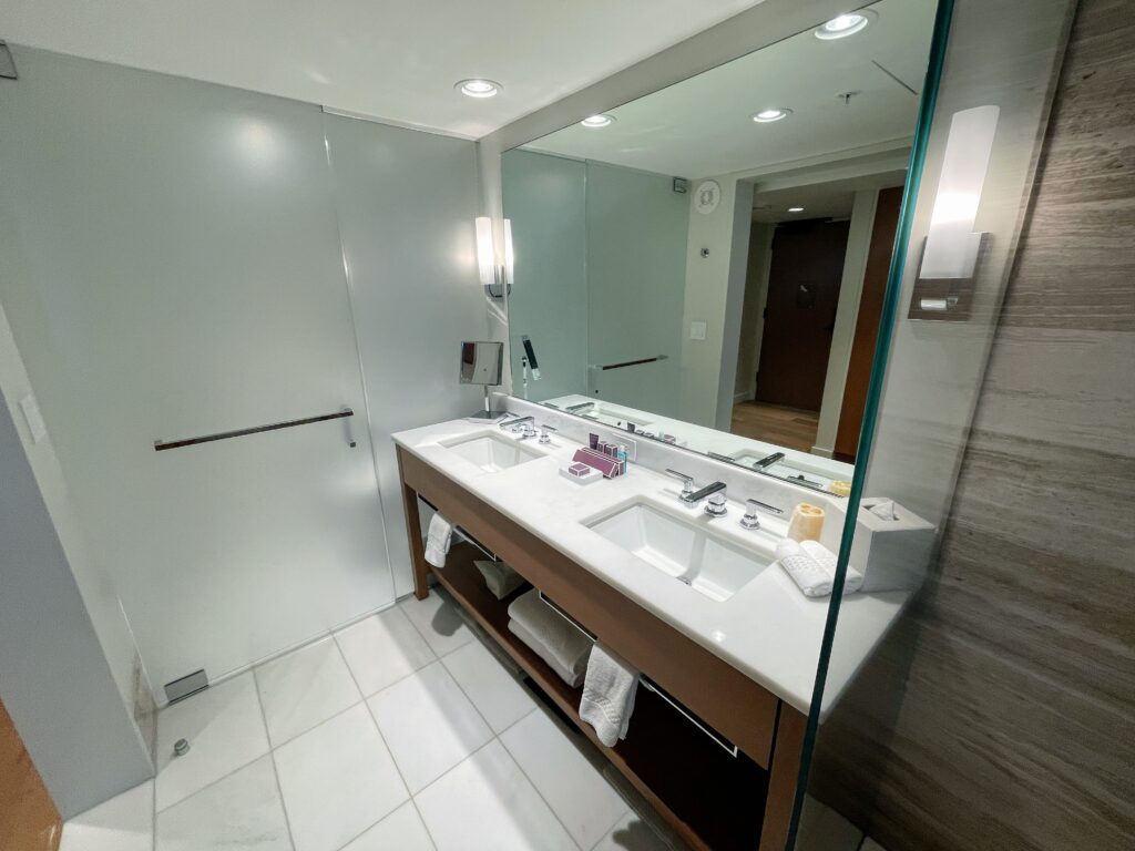 Review & Video: The Ritz-Carlton Waikiki Beach, Luxurious Residences & Hotel Hawaii Calling a bathroom with a large mirror
