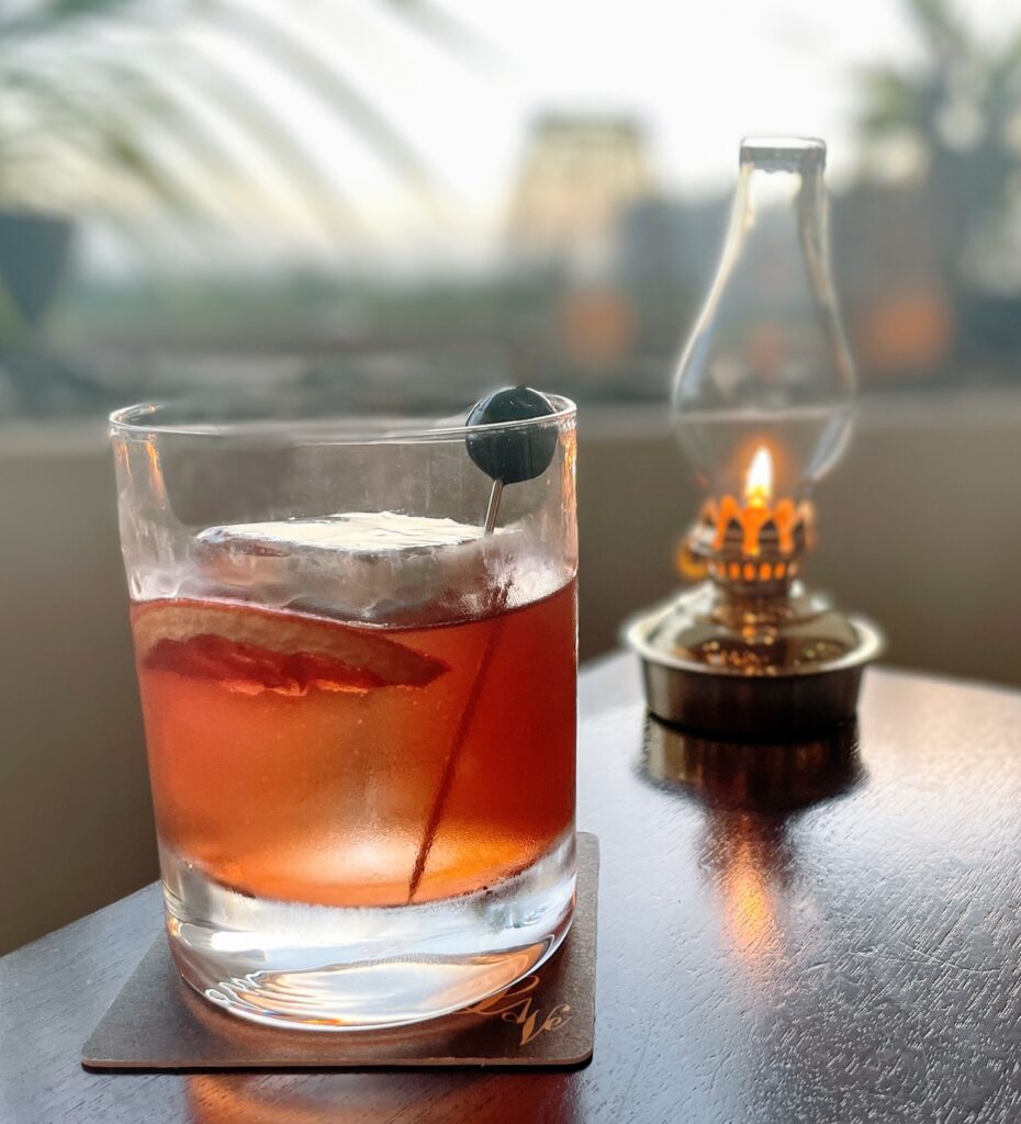 Review & Video: The Ritz-Carlton Waikiki Beach, Luxurious Residences & Hotel Hawaii Calling a glass of drink with an olive on top of a table