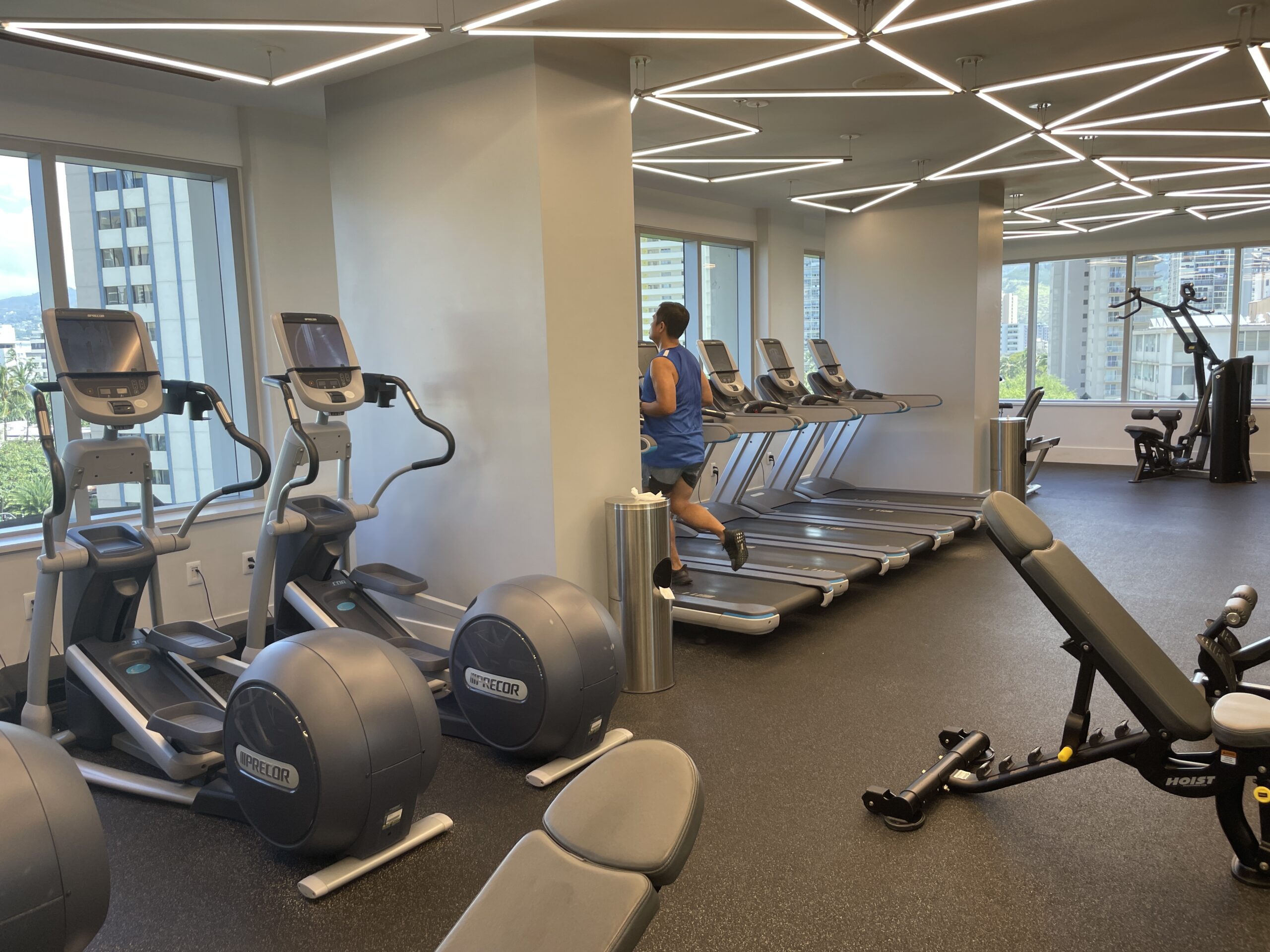 Review & Video: The Ritz-Carlton Waikiki Beach, Luxurious Residences & Hotel Hawaii Calling a man running on treadmills in a gym