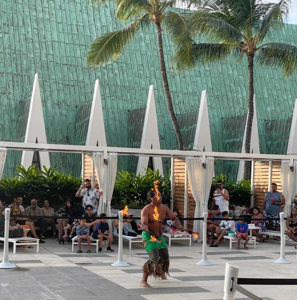 Review & Video: Waikiki Beach Marriott Resort & Spa Hawaii Calling a man with fire on his head dancing with a stick in his hand
