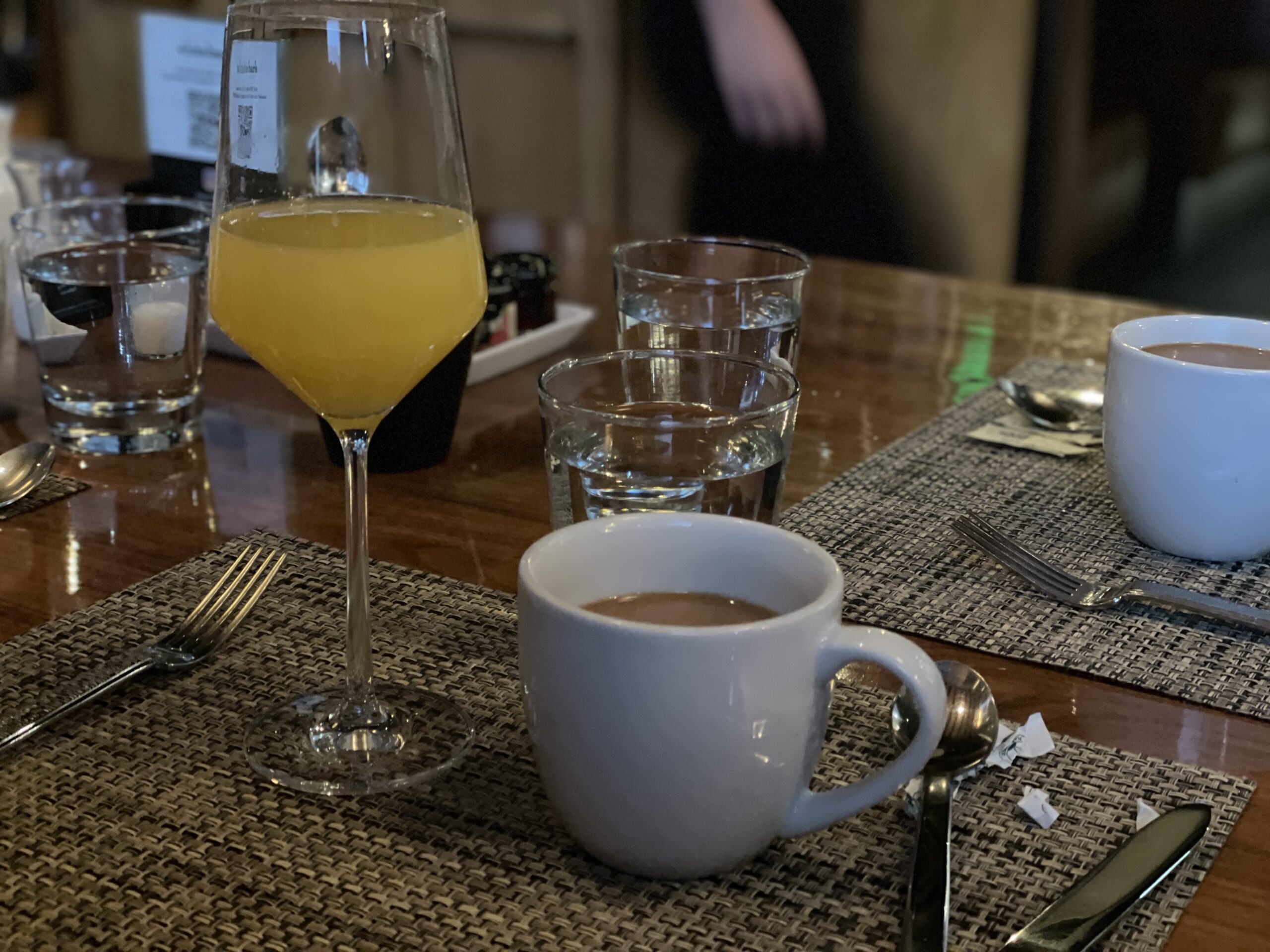 Review & Video: The Westin Monache Resort, Mammoth Mountain Hawaii Calling a table with a glass of liquid and a mug of coffee