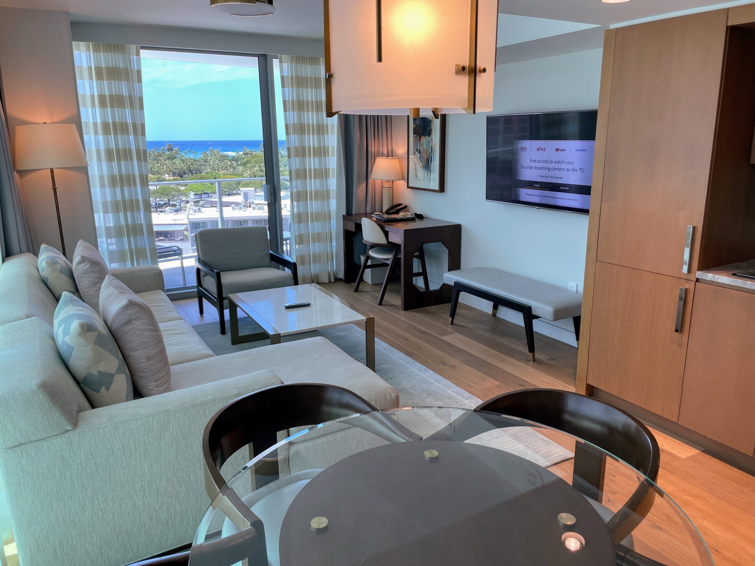 Review & Video: The Ritz-Carlton Waikiki Beach, Luxurious Residences & Hotel Hawaii Calling a living room with a television and a view of the ocean