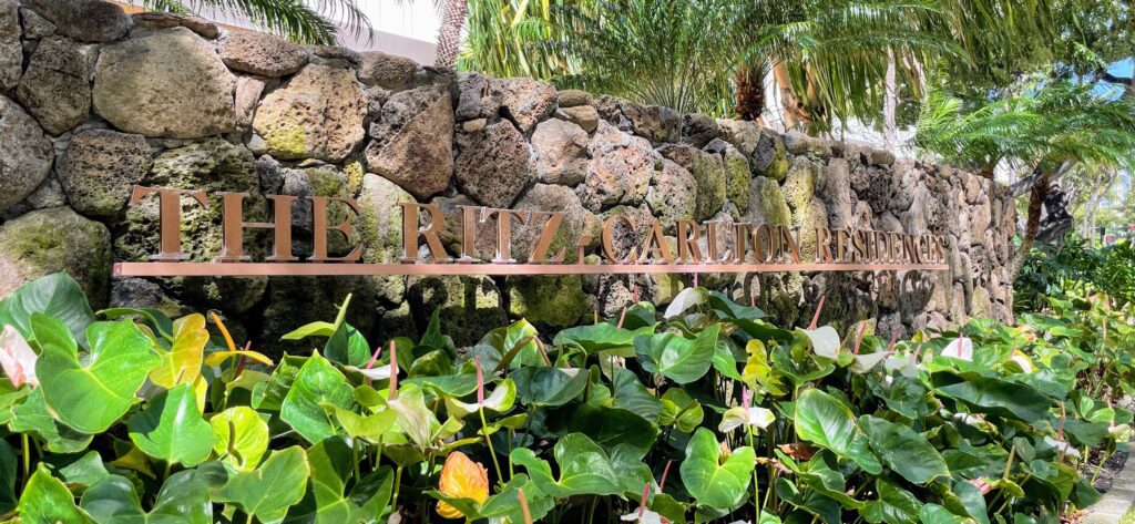 Review & Video: The Ritz-Carlton Waikiki Beach, Luxurious Residences & Hotel Hawaii Calling a sign on a stone wall