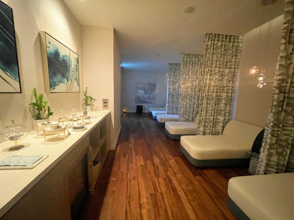 Review & Video: The Ritz-Carlton Waikiki Beach, Luxurious Residences & Hotel Hawaii Calling a room with white couches and a wood floor