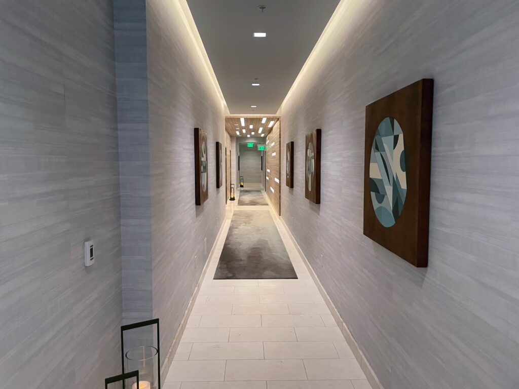 Review & Video: The Ritz-Carlton Waikiki Beach, Luxurious Residences & Hotel Hawaii Calling a long hallway with art on the wall