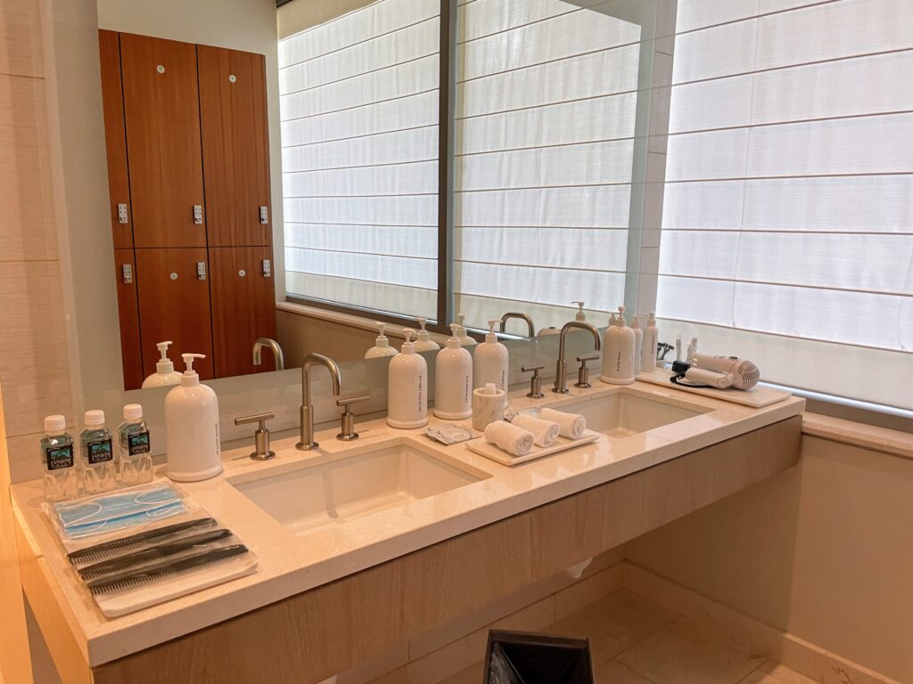 Review & Video: The Ritz-Carlton Waikiki Beach, Luxurious Residences & Hotel Hawaii Calling a bathroom with a sink and a mirror