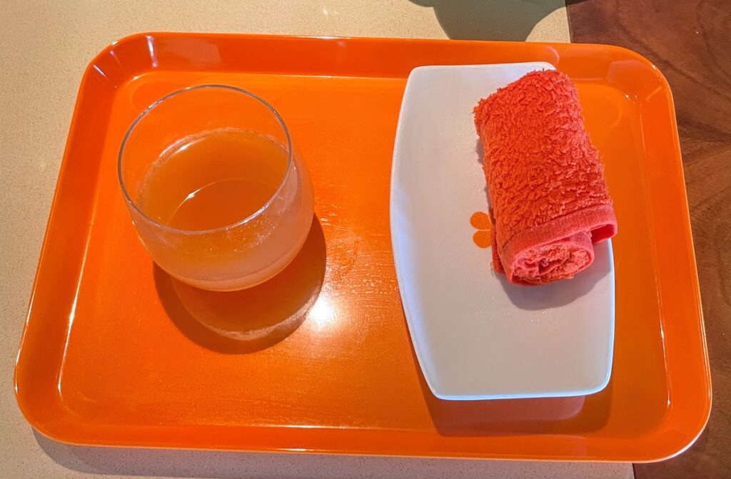 Review & Video: Mauna Kea Beach Hotel, Autograph Collection Hawaii Calling Checkin cold towel and passion orange juice at the Mauna Kea Beach Hotel