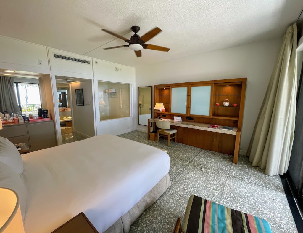 Review & Video: Mauna Kea Beach Hotel, Autograph Collection Hawaii Calling a room with a bed and a desk and a fan