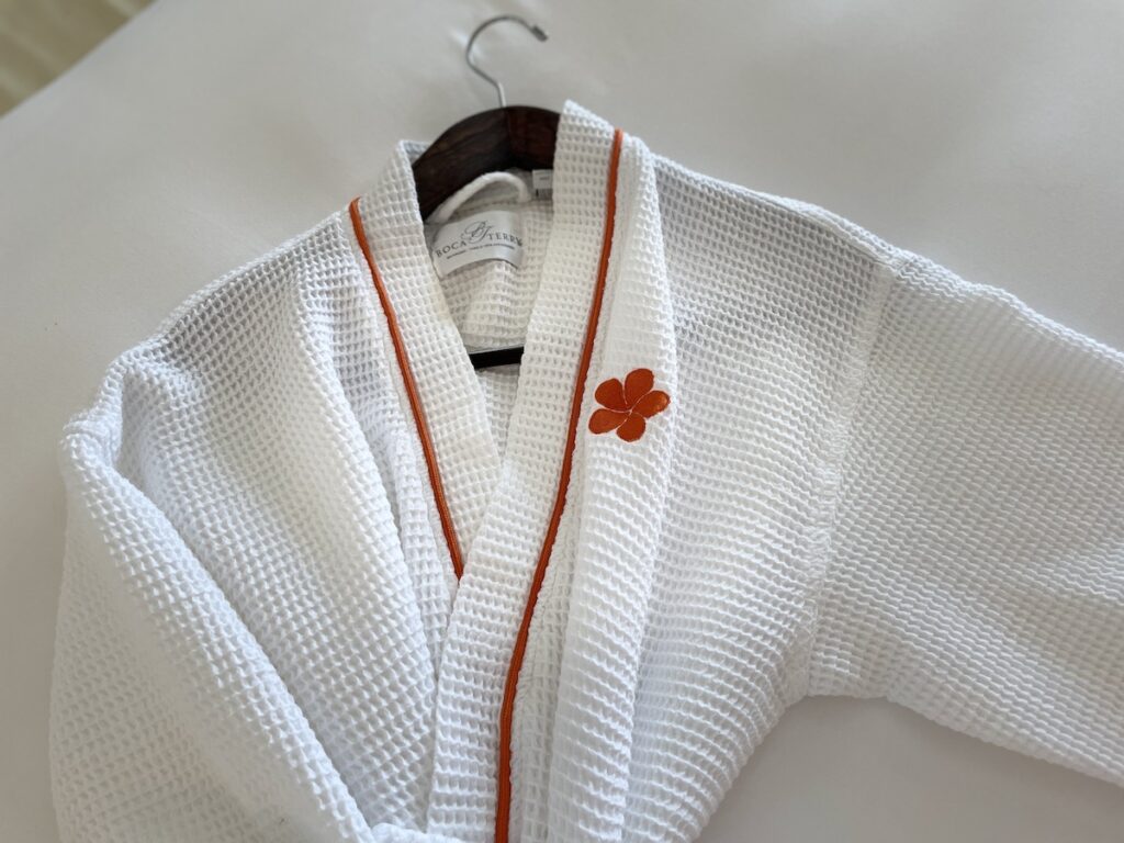 Review & Video: Mauna Kea Beach Hotel, Autograph Collection Hawaii Calling a white robe with orange trim
