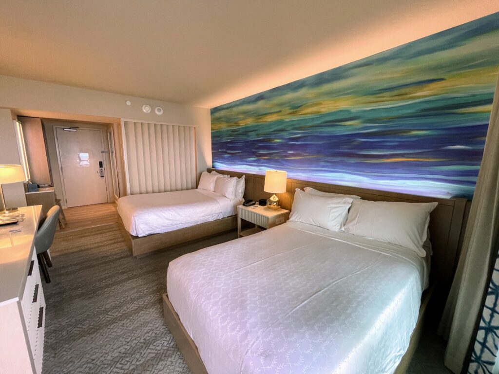 Review & Video: Sheraton Waikiki, Best Family Hotel on Oahu Hawaii Calling a room with two beds and a painting on the wall