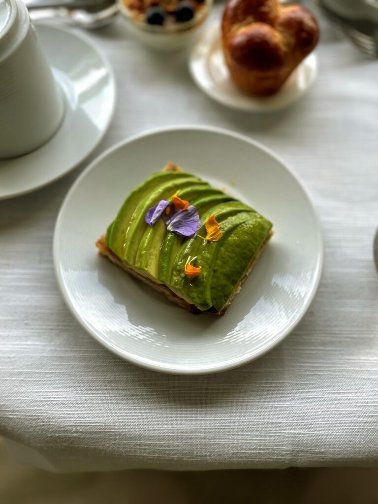 Review & Video: The Kahala Hotel and Resort, Presidential Luxury Hawaii Calling a plate of food with avocado and flowers on it