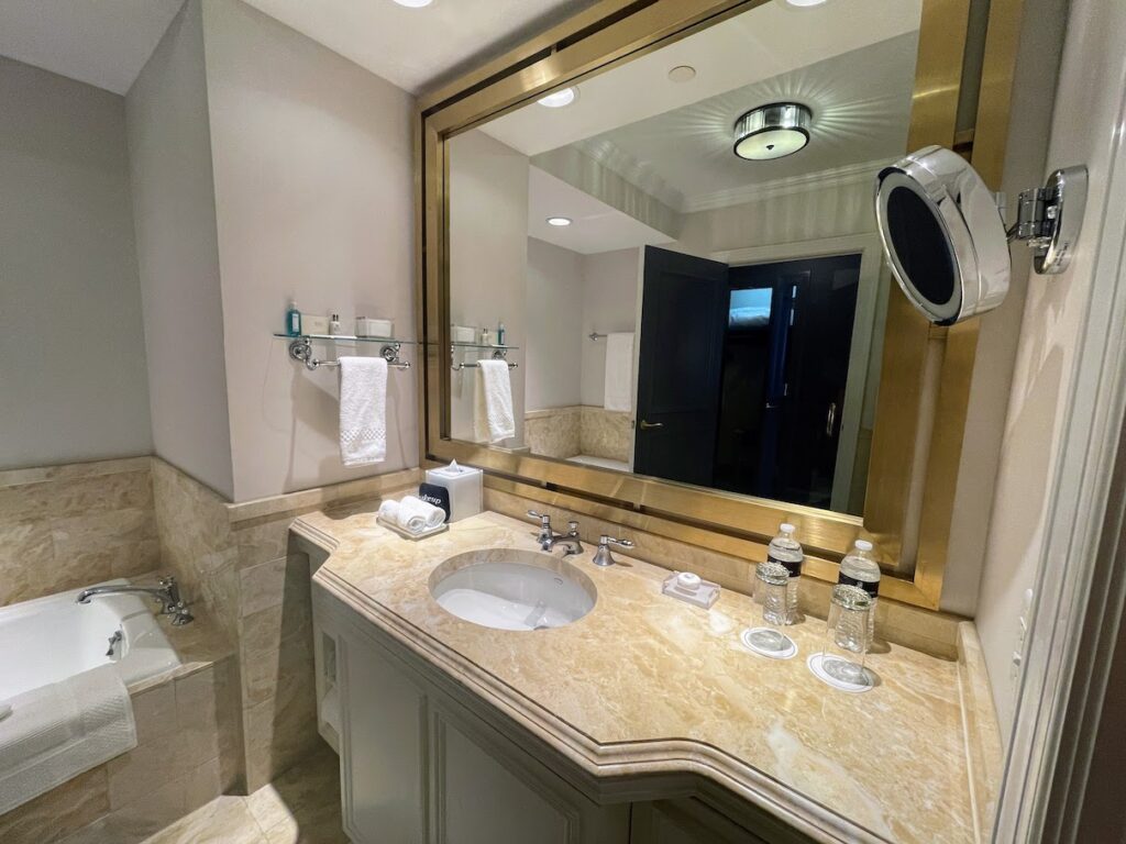 Review & Video: The Ritz-Carlton Washington DC, Refined Luxury Hawaii Calling a bathroom with a large mirror and sink