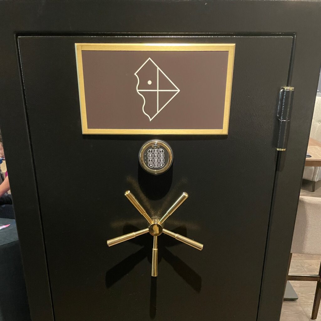 Review & Video: The Ritz-Carlton Washington DC, Refined Luxury Hawaii Calling a black safe with a gold handle