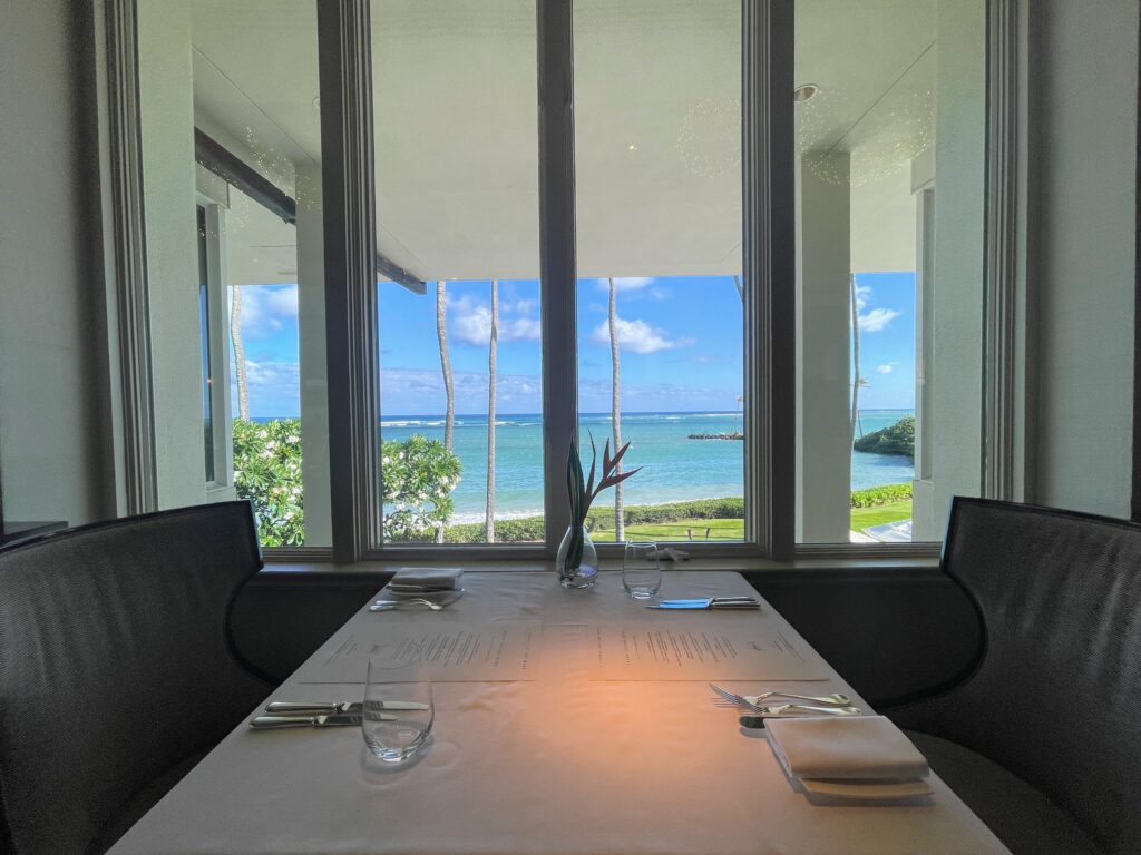 Review & Video: The Kahala Hotel and Resort, Presidential Luxury Hawaii Calling a table with a white tablecloth and glasses on it with a view of the ocean