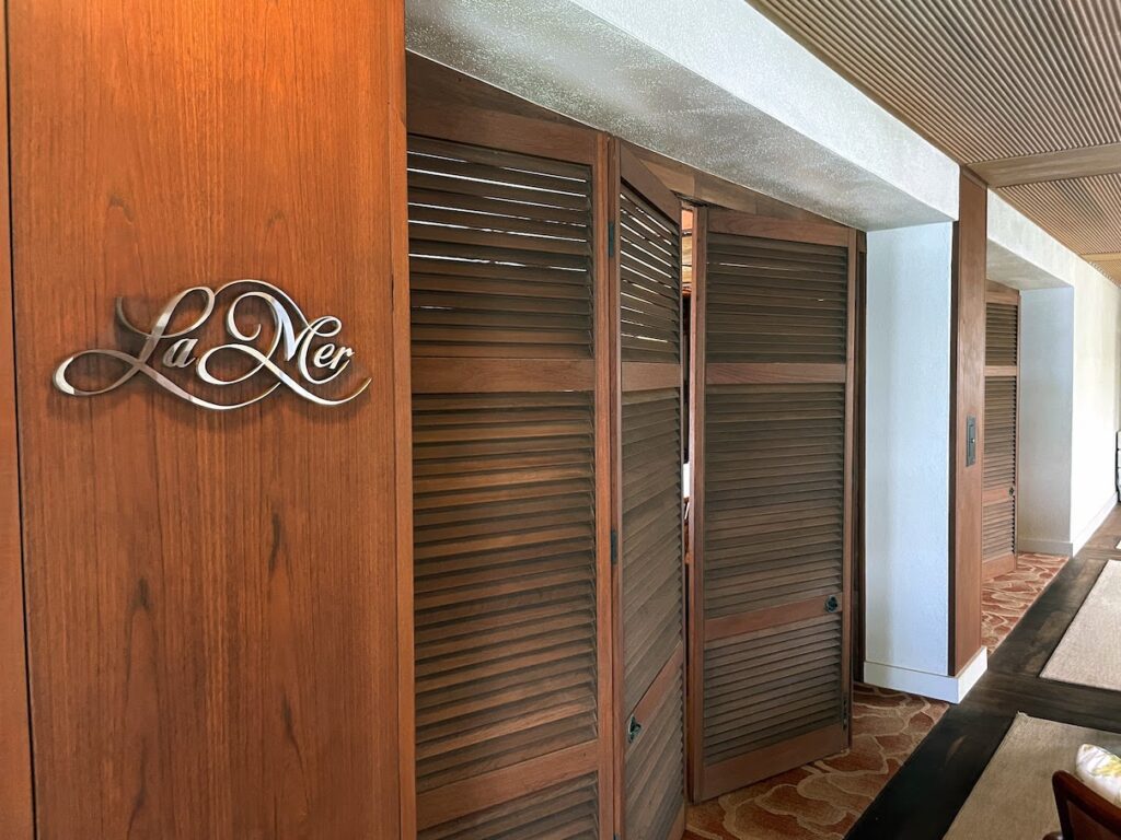 a room with a door and a sign