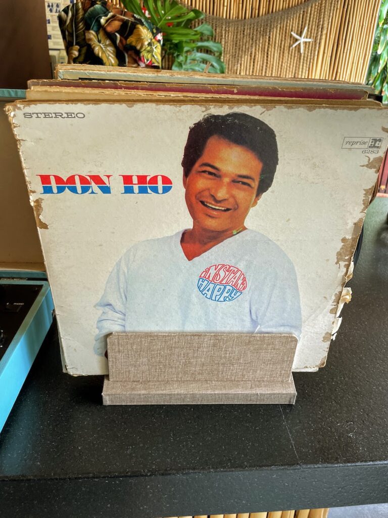 Review & Video: White Sands Hotel, Boutique & Smart Hawaii Calling a record album cover on a table