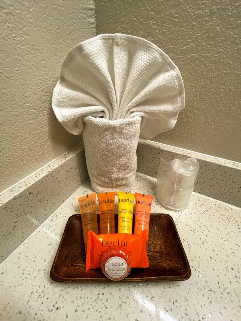 Review & Video: White Sands Hotel, Boutique & Smart Hawaii Calling a tray with a towel wrapped around it and a towel wrapped around it