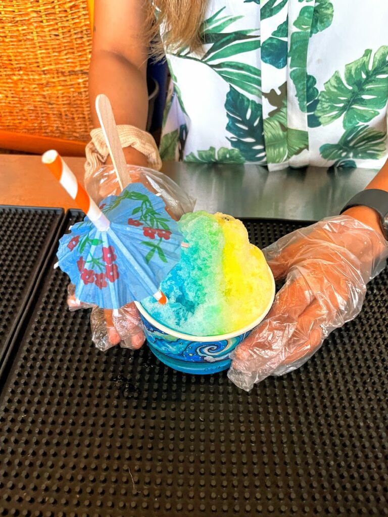 Review & Video: White Sands Hotel, Boutique & Smart Hawaii Calling a person holding a cup of shaved ice