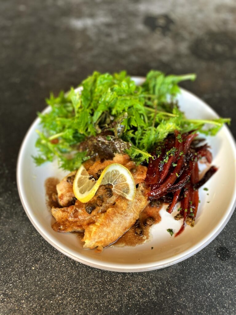 Review & Video: White Sands Hotel, Boutique & Smart Hawaii Calling a plate of food on a table