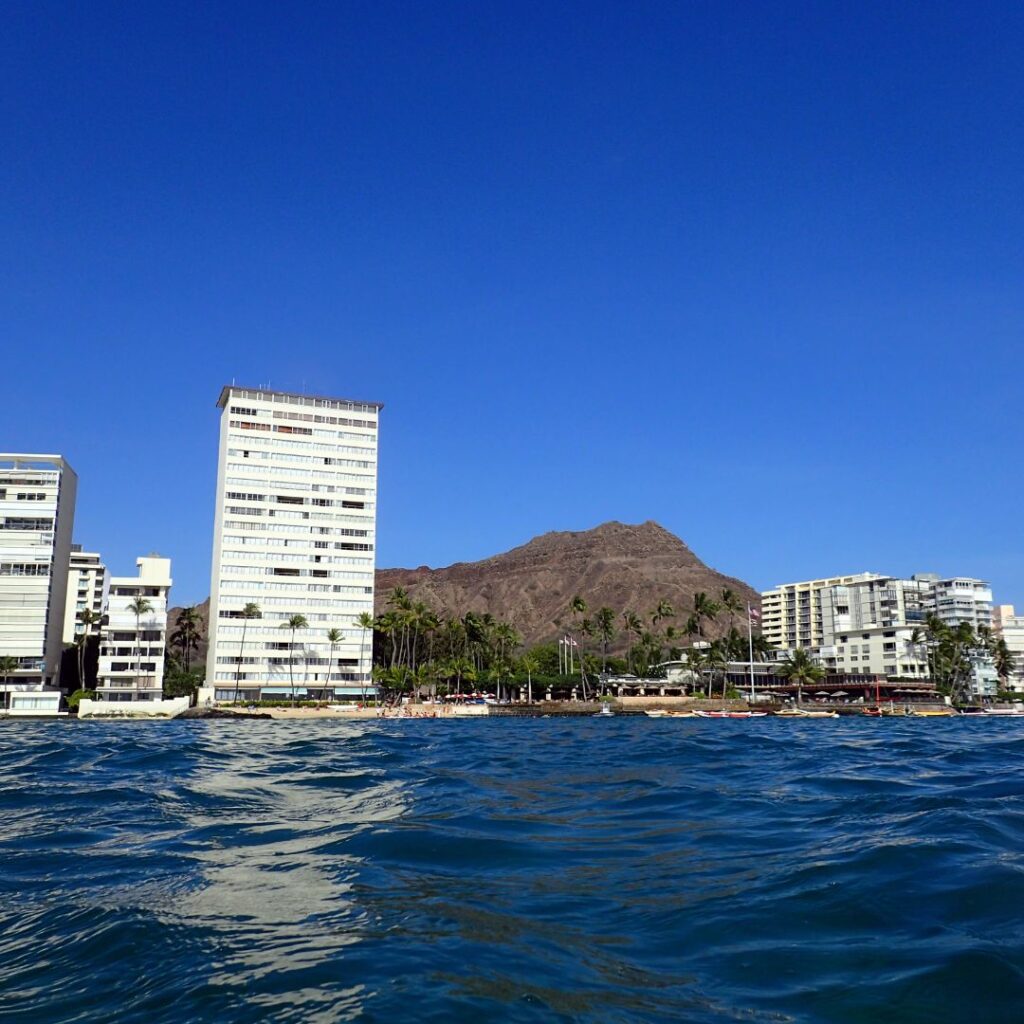 6 Amazing Boutique Hotels on Oahu (2025) Hawaii Calling a body of water with buildings and mountains in the background