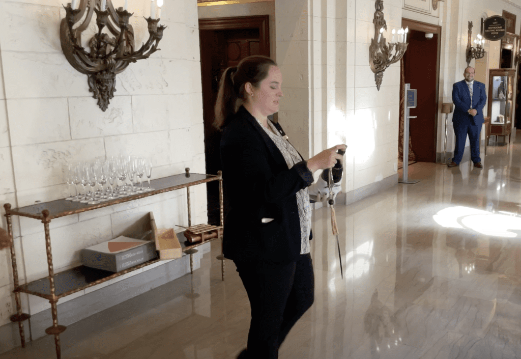 Review & Video: The St. Regis Washington DC, Historic Luxury Hawaii Calling a woman holding a device