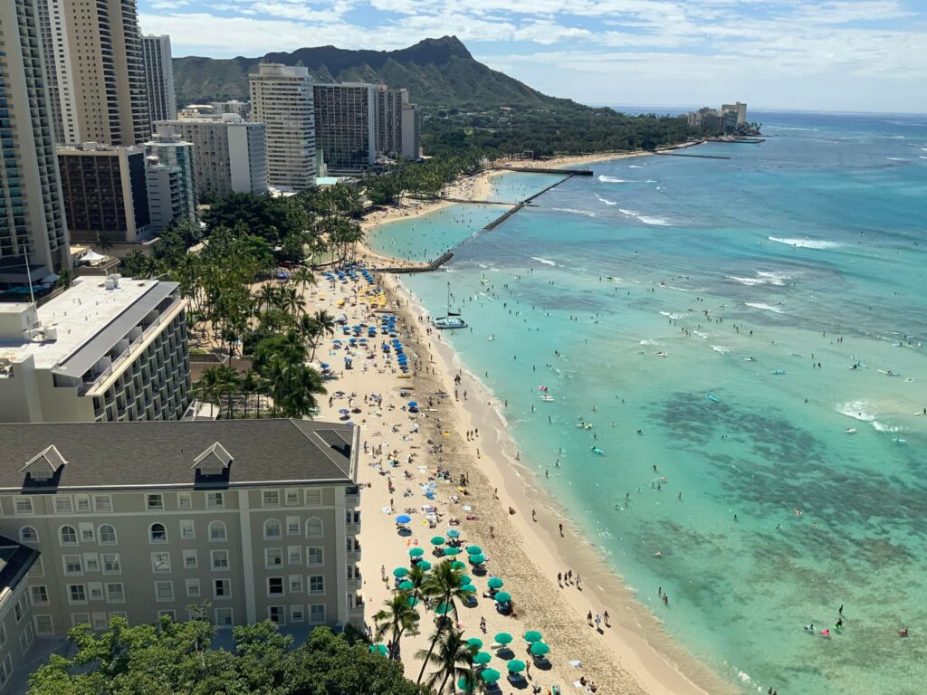 Luxury Oahu 7 Day Itinerary 2023 Hawaii Calling a beach with buildings and people on it