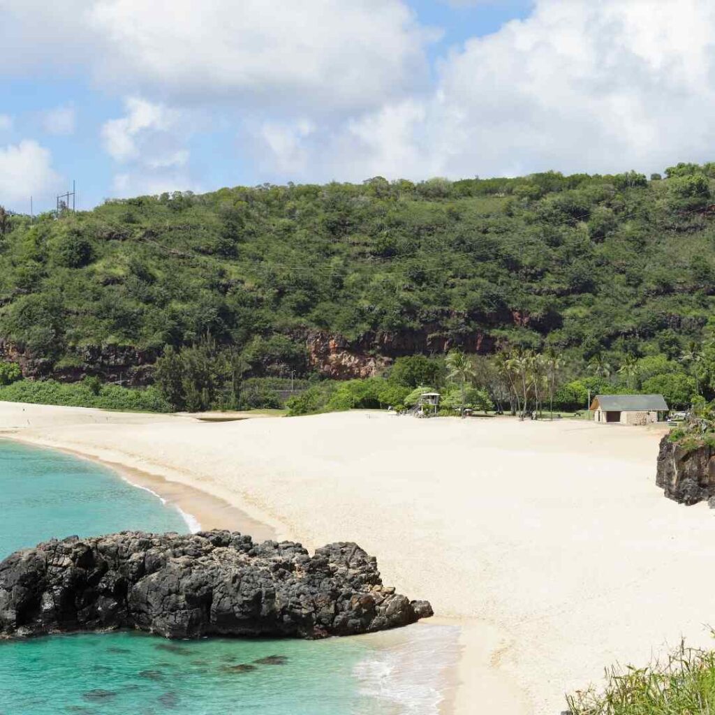 Luxury Oahu 7 Day Itinerary 2023 Hawaii Calling a beach with rocks and trees
