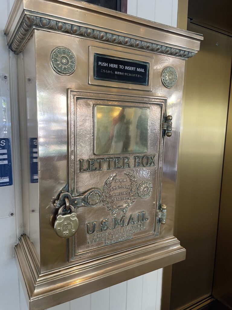 Review & Video: Moana Surfrider, Waikiki Beach Beauty Hawaii Calling a gold mail box with a lock