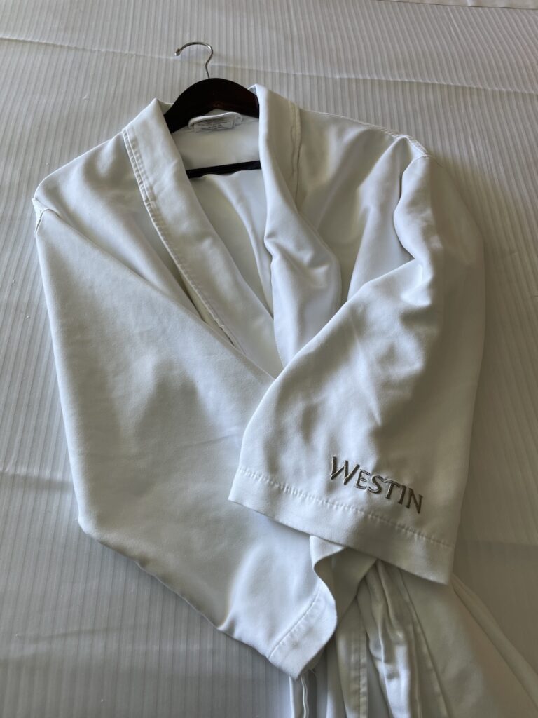 Review & Video: Moana Surfrider, Waikiki Beach Beauty Hawaii Calling a white robe on a white surface