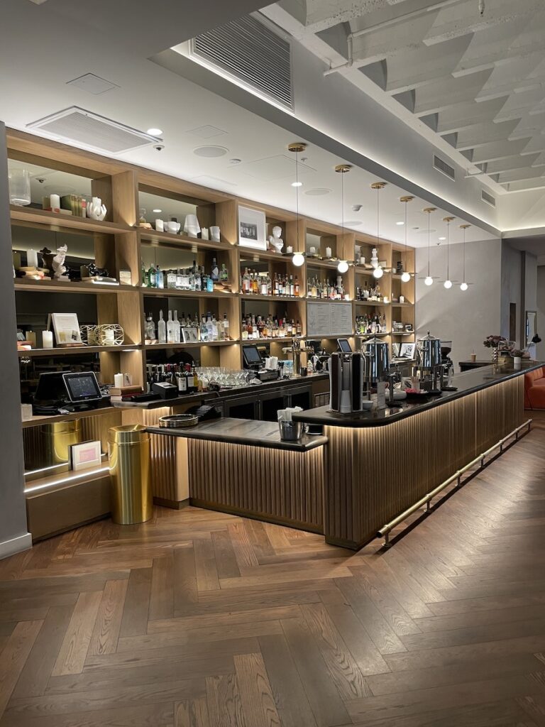 Review & Video: The Guild Hotel, San Diego, a Tribute Portfolio Hotel Hawaii Calling a bar with shelves of liquor and a wood floor