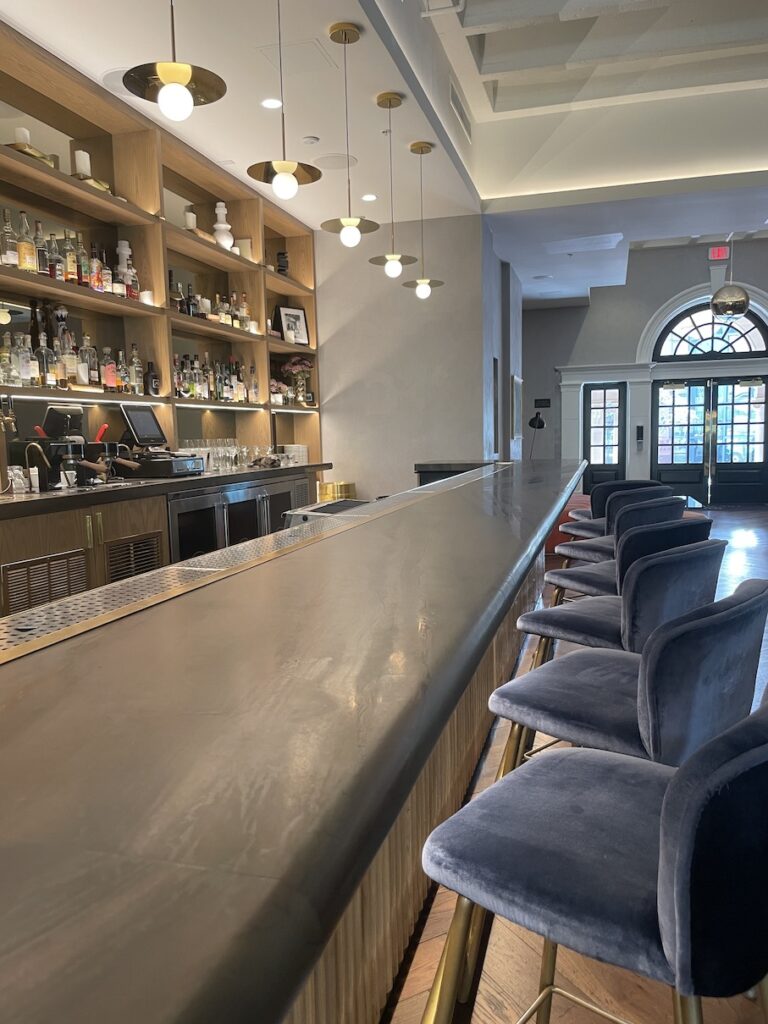 Review & Video: The Guild Hotel, San Diego, a Tribute Portfolio Hotel Hawaii Calling a bar with chairs and shelves in front of it