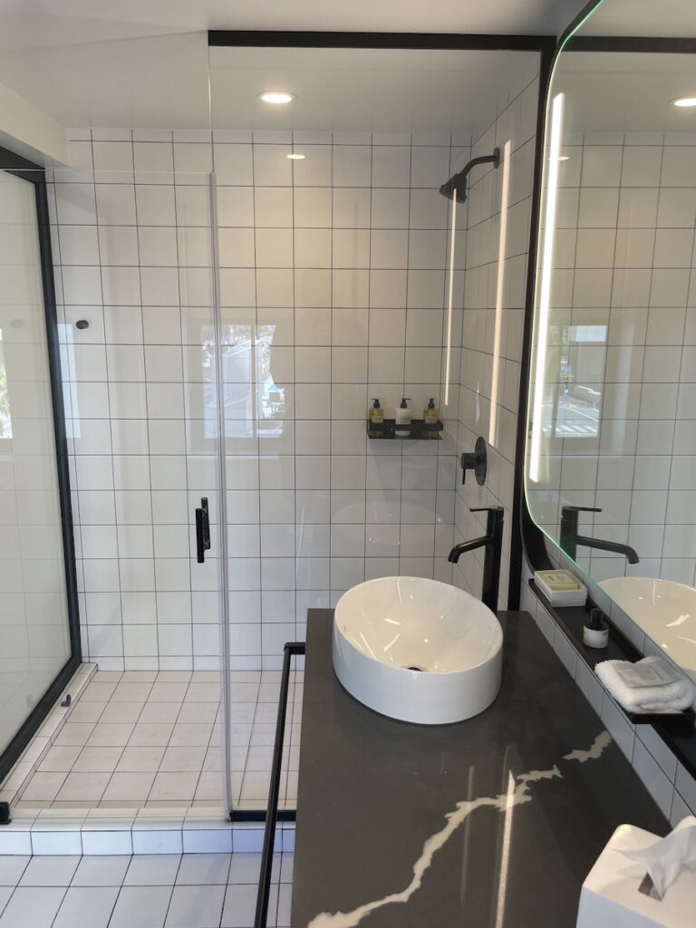 Review & Video: The Guild Hotel, San Diego, a Tribute Portfolio Hotel Hawaii Calling a bathroom with a sink and shower