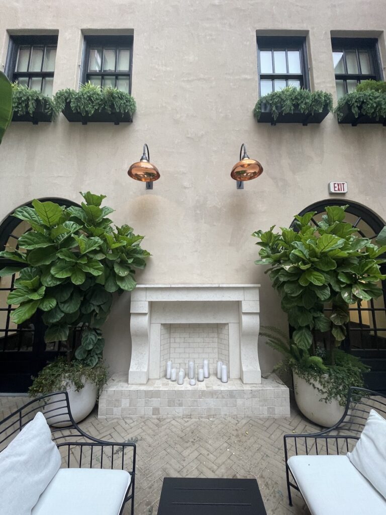 Review & Video: The Guild Hotel, San Diego, a Tribute Portfolio Hotel Hawaii Calling a building with a fireplace and plants
