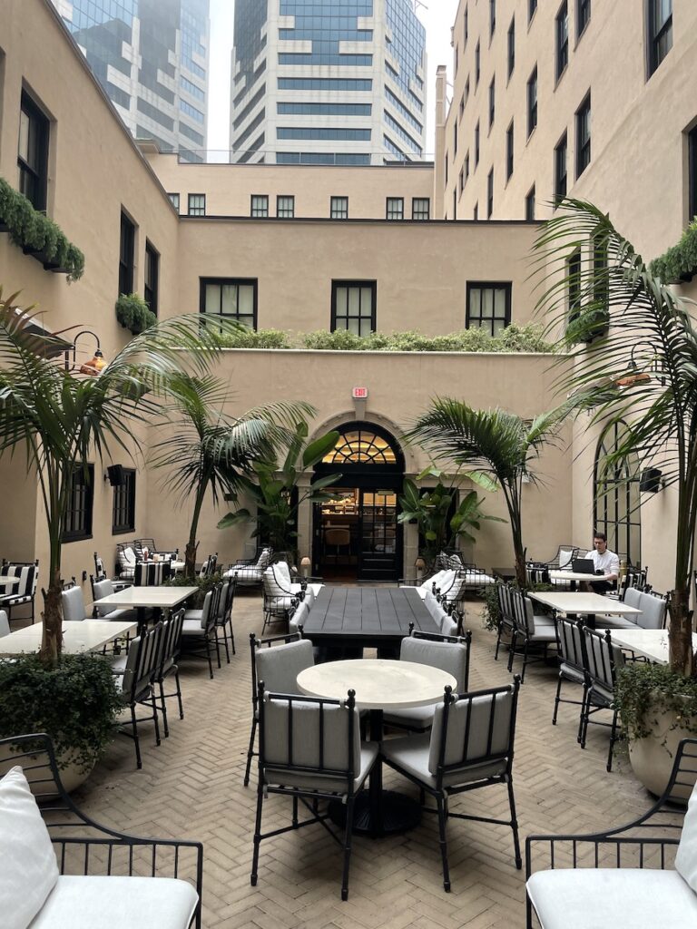 Review & Video: The Guild Hotel, San Diego, a Tribute Portfolio Hotel Hawaii Calling a courtyard with tables and chairs