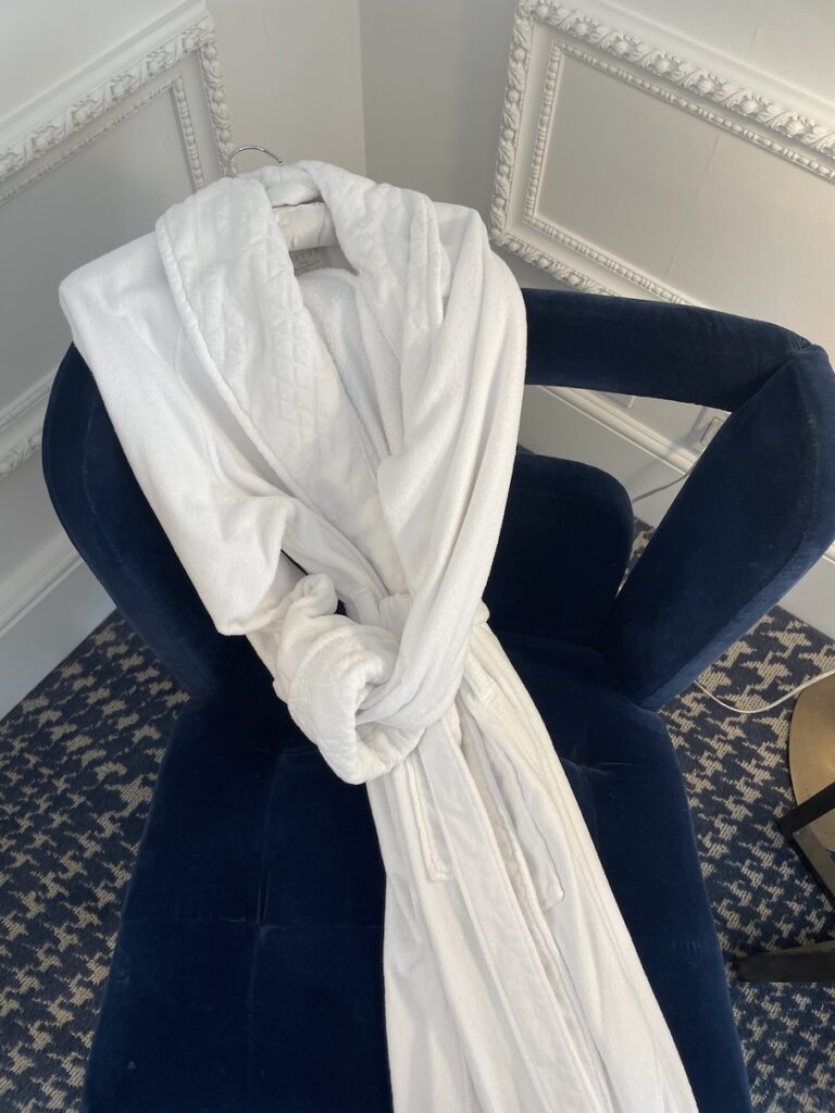 12 Plush & Cozy Hotel Robes Of The World Hawaii Calling a white robe on a blue chair