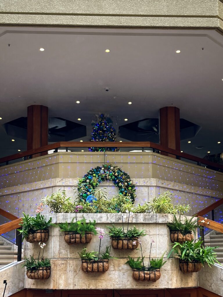 17 Gorgeous Waikiki Hotel Christmas Trees Hawaii Calling a staircase with a decorated tree and plants