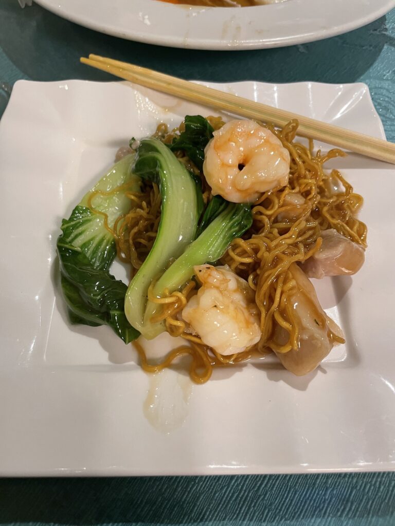 Kirin Waikiki | Mysterious Underground Dinner Review Hawaii Calling a plate of food with chopsticks