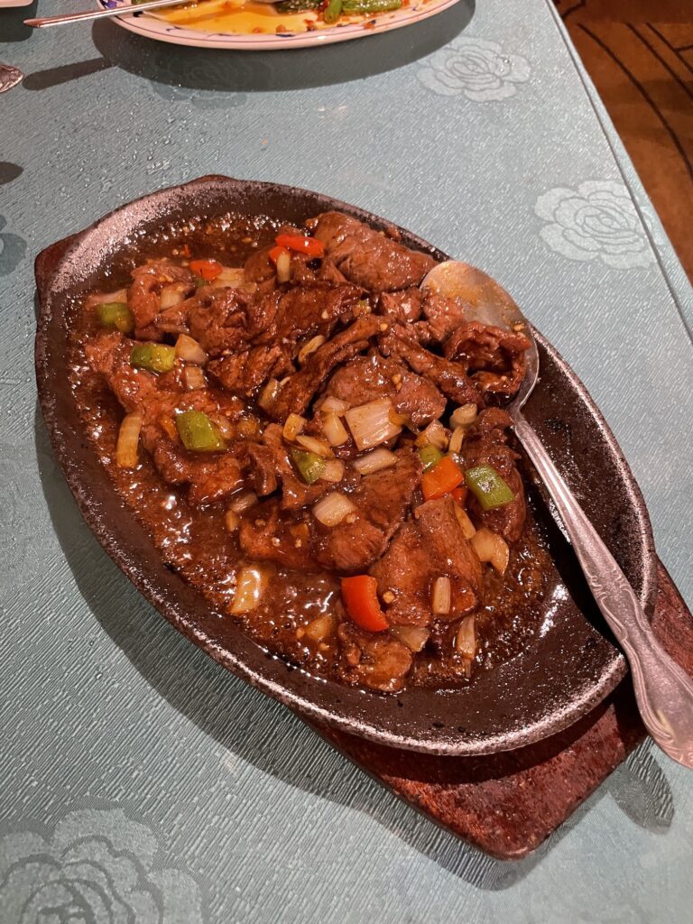 Kirin Waikiki | Mysterious Underground Dinner Review Hawaii Calling a plate of food with a spoon